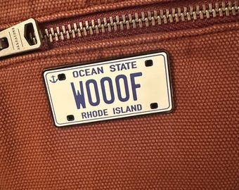 Dumb & Dumber inspired WOOF Mutt’s Cuts License Plate Pin