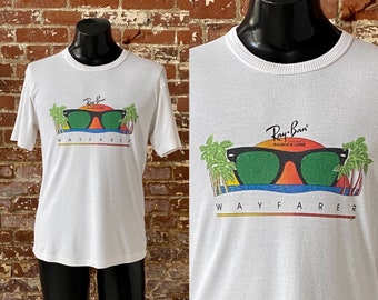 80s Ray Ban Wayfarer Sunglasses T-Shirt. Vintage 1987 Ray Ban By Bausch & Lomb Wayfarer Sunglasses Promo Tee Single Stitch - Med 20" x 28.5"