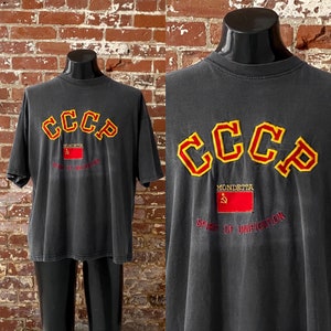 90s Mondetta A Spirit Of Unification CCCP USSR Embroidered T-Shirt. Vintage 1990s Sun Faded Black Mondetta Tee. Made in USA - 2XL 26&quot; x 28&quot;