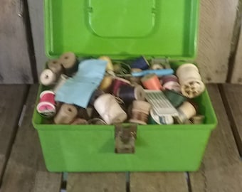 Vintage Sewing Box Filled With Thread And Empty Wooden Spools