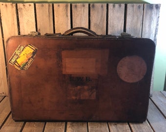 Vintage Leather Suitcase with Travel Stickers