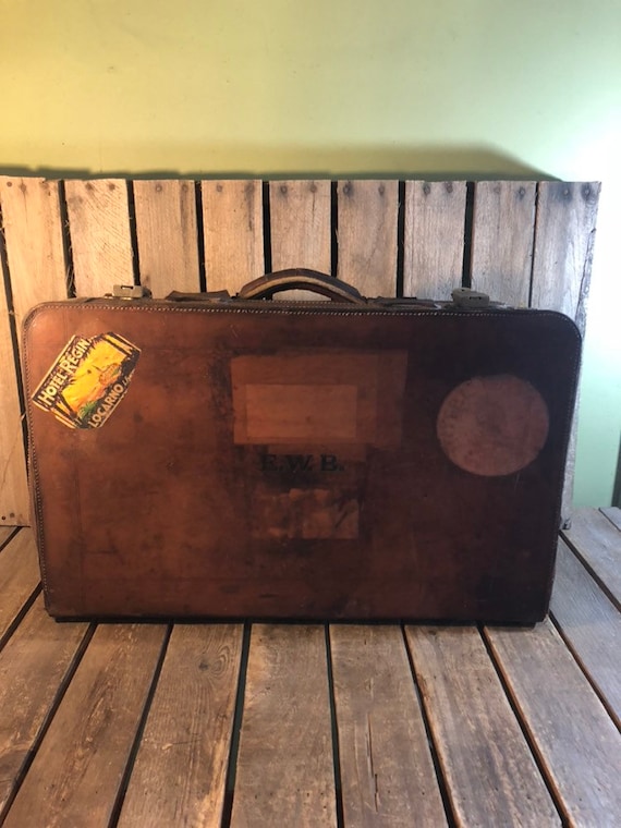 old suitcase with travel stickers