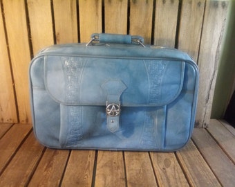 Vintage blauwe koffer, verdrietig wornout koffer