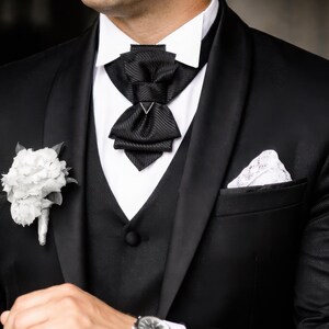 unique tie for groom, black bow tie for wedding, minimalist bow tie, stylish tie, wedding black tie, statement neckwear, modern necktie, formal neckwear, luxury fashion accessory, handcrafted men’s wear, chic fashion tie, groomsmen gift idea, vertical bow tie, timeless style tie, elegant neckwear, artisan accessories, tailored necktie, unisex tie, classic necktie, handmade necktie