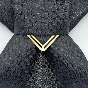black vertical bow tie, handmade bow tie, pre tied bow tie, cascading bow tie, groom bow tie, wedding bow tie, unique bow tie, sculptural bow tie, black necktie, designer bow tie, bow tie for men, formal bow tie, gold accent bow tie, statement bow tie, luxury bow tie, handmade in Lithuania, bow tie for wedding, elegant bow tie, modern bow tie, bow tie with gold detail, viscose bow tie, bow tie gift for groom, black tie alternative, bow tie for musicians, unisex bow tie