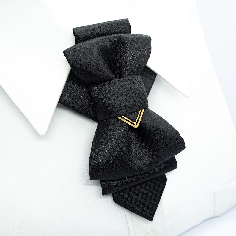 black vertical bow tie, handmade bow tie, pre tied bow tie, cascading bow tie, groom bow tie, wedding bow tie, unique bow tie, sculptural bow tie, black necktie, designer bow tie, bow tie for men, formal bow tie, gold accent bow tie, statement bow tie, luxury bow tie, handmade in Lithuania, bow tie for wedding, elegant bow tie, modern bow tie, bow tie with gold detail, viscose bow tie, bow tie gift for groom, black tie alternative, bow tie for musicians, unisex bow tie