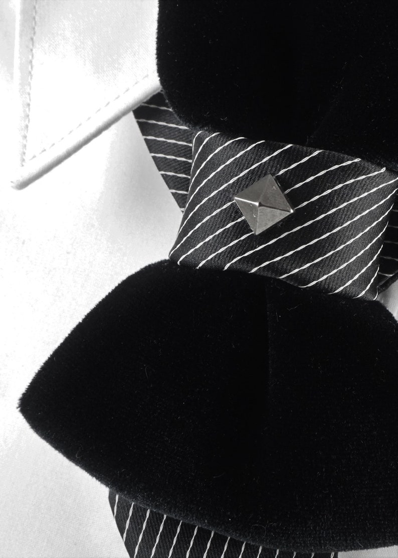 Unique black necktie, Wedding bow tie, Attention magnet black cravat, Black unisex tie black velvet vertical bow tie, designer statement tie for men, unique groom wedding bow tie, handmade velvet bow tie, modern vertical bow tie design, black velvet groom tie, artistic men’s neckwear accessory, luxury designer bow tie, pinstripe accent bow tie, metallic stud bow tie detail, elegant groom wedding accessory, contemporary formal bow tie, unique men’s wedding tie, elegant velvet neckwear