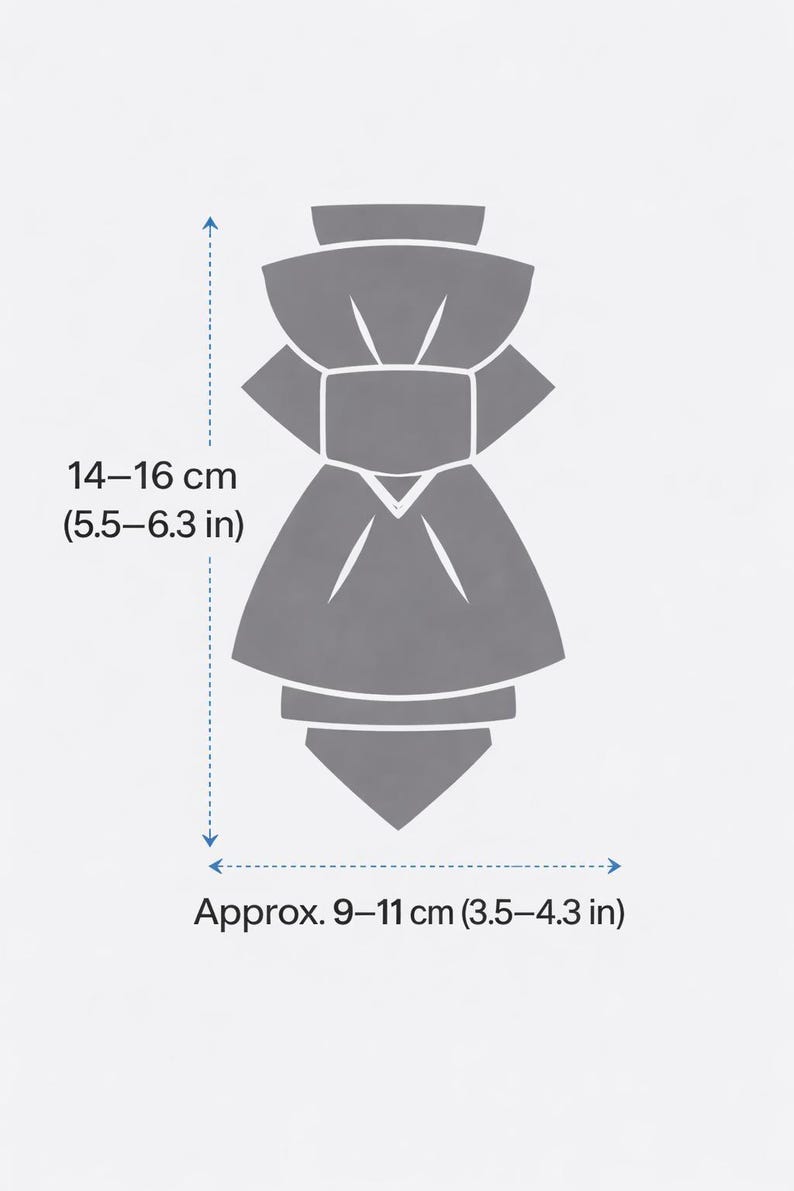 May include: A gray, stylized illustration of a bow tie. The bow tie is approximately 5.5-6.3 inches in length and 3.5-4.3 inches in width. The image includes measurements in inches and centimeters.