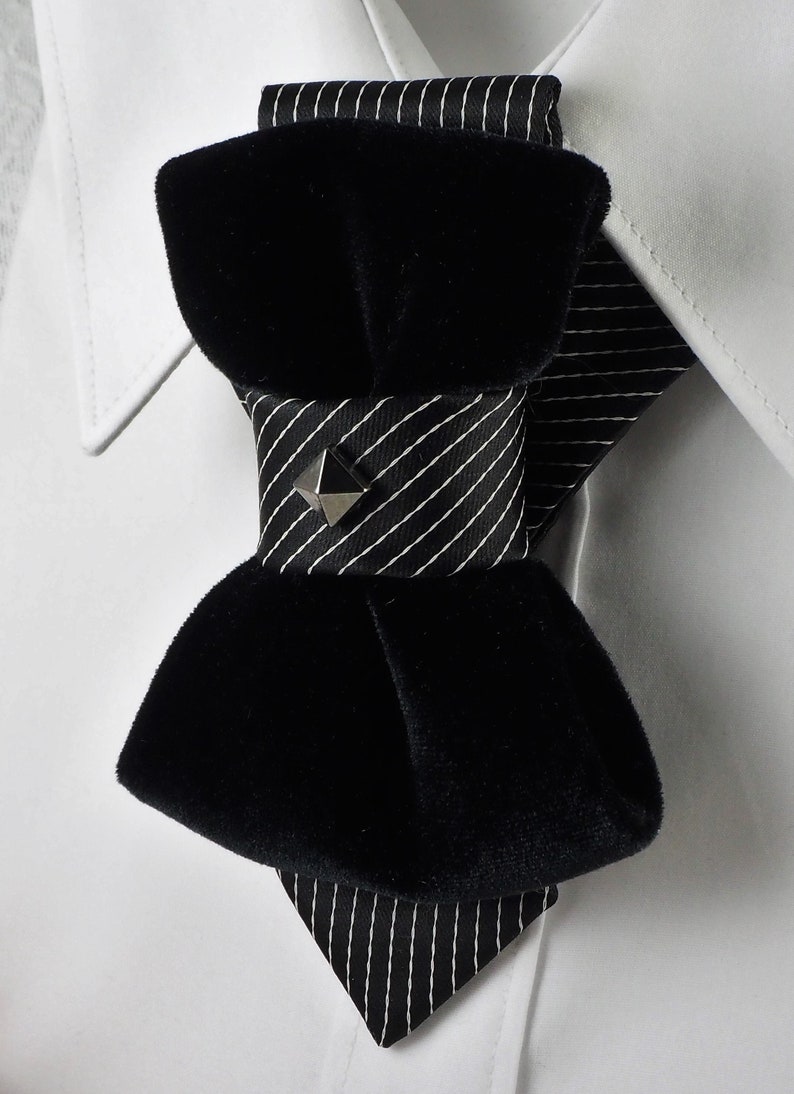 Unique black necktie, Wedding bow tie, Attention magnet black cravat, Black unisex tie black velvet vertical bow tie, designer statement tie for men, unique groom wedding bow tie, handmade velvet bow tie, modern vertical bow tie design, black velvet groom tie, artistic men’s neckwear accessory, luxury designer bow tie, pinstripe accent bow tie, metallic stud bow tie detail, elegant groom wedding accessory, contemporary formal bow tie, unique men’s wedding tie, shandcrafted designer necktie