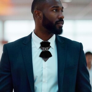 black velvet vertical bow tie, designer statement tie for men, modern vertical bow tie design, black velvet groom tie, luxury designer bow tie, pinstripe accent bow tie, metallic stud bow tie detail, elegant groom wedding accessory, contemporary formal bow tie, unique men’s wedding tie, statement bow tie for tuxedo, modern groom style tie, fashion forward men’s bow tie, handcrafted designer necktie, artistic groom accessory, elegant velvet neckwear, distinctive vertical bow tie