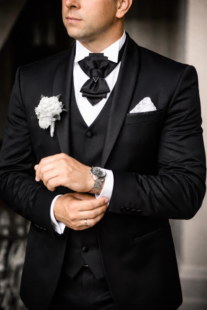 unique tie for groom, black bow tie for wedding, minimalist bow tie, stylish tie, wedding black tie, statement neckwear, modern necktie, formal neckwear, luxury fashion accessory, handcrafted men’s wear, chic fashion tie, groomsmen gift idea, vertical bow tie, timeless style tie, elegant neckwear, artisan accessories, tailored necktie, unisex tie, classic necktie, handmade necktie