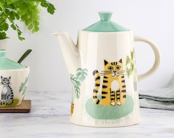 Cat Design Teapot, handmade ceramic Cat Teapot, designed in the UK by Hannah Turner. Adorned with vintage cats on rugs with plants.