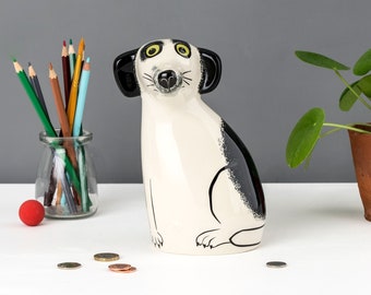 Handmade Ceramic Black and White Dog Money Box, designed in the UK by Hannah Turner. Get saving in style with this retro Dog Money Bank.