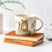 Handmade Ceramic Cat Mug, designed in the UK by Hannah Turner. Perfect Mug for Morning Tea or Coffee, Gift Boxed Pottery Mug 