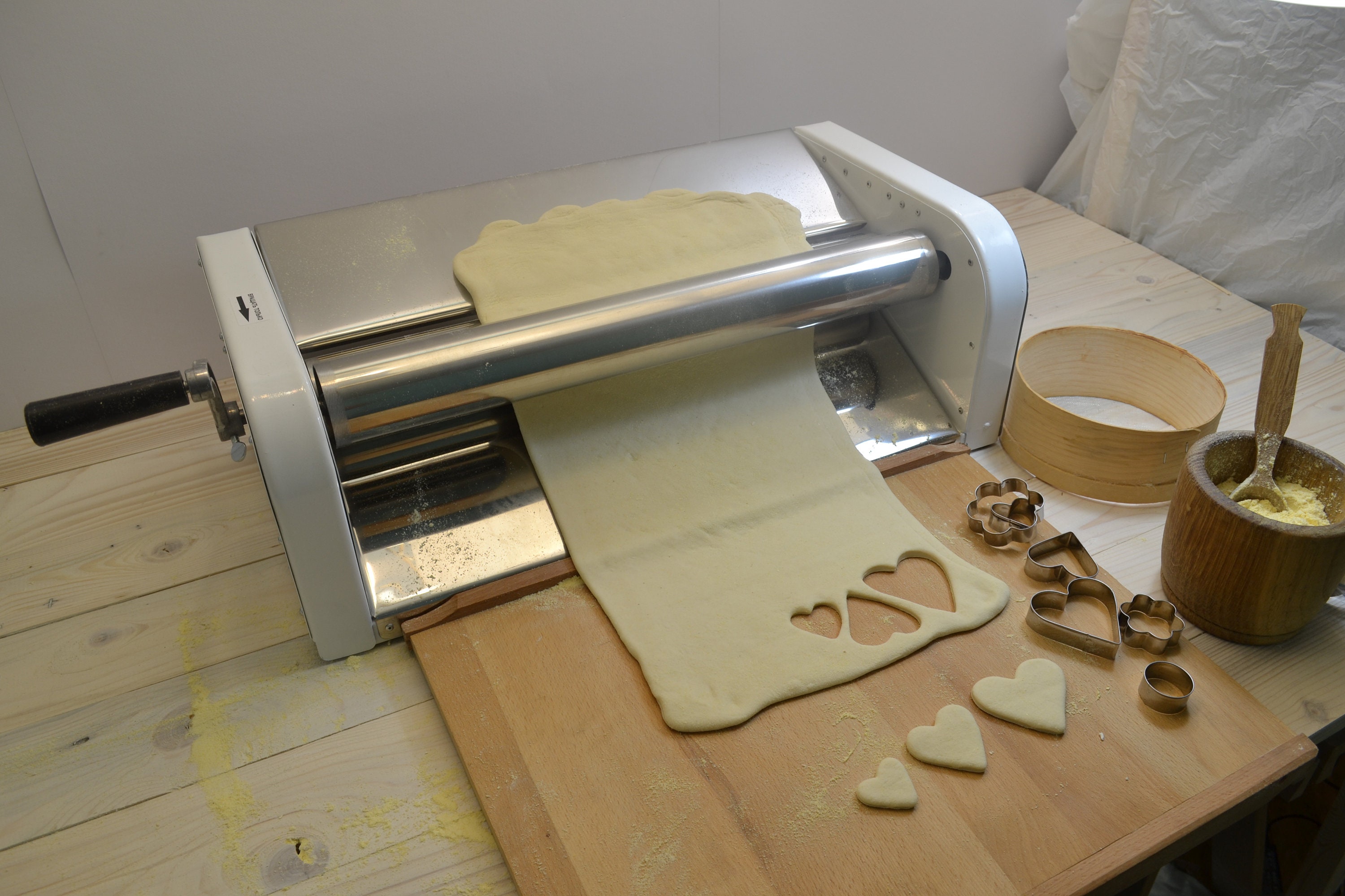 Manual dough sheeter on table