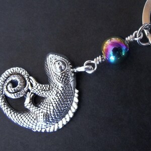May include: Silver chameleon keychain with an iridescent purple and blue bead.
