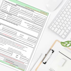 May include: A white document with a black border, titled "SUBCONTRACTOR REGISTRATION FORM & CONTRACT," is on a white surface. A keyboard, mouse, clipboard, and pen are also visible. The document has several fields for personal and business information.