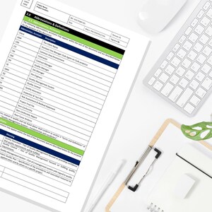 May include: A document titled "Abbreviations & Definitions" with a list of acronyms and descriptions, along with a keyboard, clipboard, and pen on a white surface. The document is part of a project, with the status "FOR CONSTRUCTION".