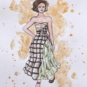 Peut inclure: Une tasse en c&eacute;ramique blanche avec une anse noire et le texte "But First, Coffee" en noir, en gras. La tasse est pos&eacute;e sur une surface blanche.