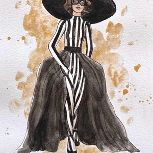 Peut inclure: Une tasse en c&eacute;ramique blanche avec une anse noire et le texte "But First, Coffee" en noir, en gras. La tasse est pos&eacute;e sur une surface blanche.