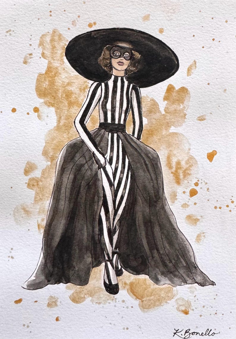 Peut inclure: Une tasse en c&eacute;ramique blanche avec une anse noire et le texte "But First, Coffee" en noir, en gras. La tasse est pos&eacute;e sur une surface blanche.