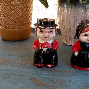 Pair of Vintage porcelain Amish couple salt and pepper shakers