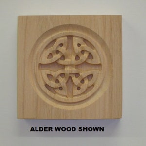 May include: A wooden plaque with a carved Celtic knot design. The plaque is made of alder wood and has a natural finish. "Alder Wood Shown" is written below the design.