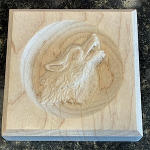 May include: A rustic wooden sign with the text "Welcome to our home" in white lettering. The sign features a distressed finish and a simple, inviting design, perfect for entryway decor.