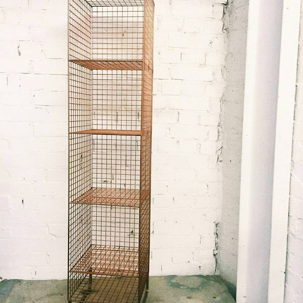 Copper coloured metal wired shelving unit