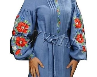 May include: A blue linen dress with embroidered red and blue flowers on the sleeves. The dress has a belt and a round neckline.