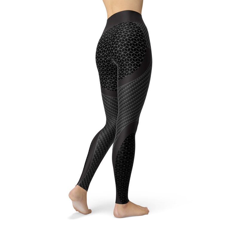 May include: Black leggings with a geometric pattern and a carbon fiber design.