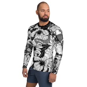 May include: Black and white long-sleeve shirt with a graphic print of koi fish, flowers, and waves.