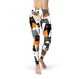 May include: Black, white, orange, and gray leggings with a repeating pattern of cartoon cats.