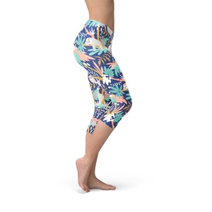 May include: Blue capri leggings with a colorful print of sloths and tropical leaves.
