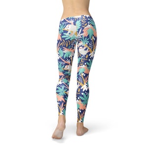 May include: Navy leggings featuring a repeating pattern of sloths, tropical plants, and flowers in white, coral, and teal. The leggings are form-fitting and made of a soft, stretchy material.