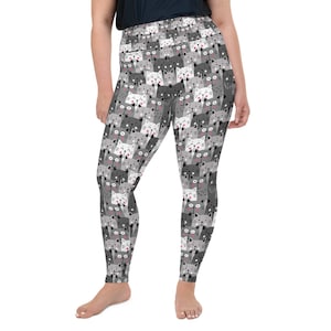 May include: Gray leggings with a repeating pattern of white and gray cats with pink noses. The cats are all looking at the viewer.