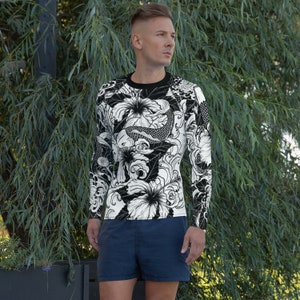 May include: Black and white long-sleeved shirt with a graphic print of koi fish and flowers.