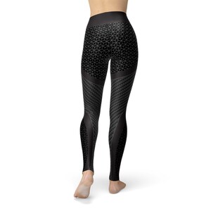 May include: Black leggings with a geometric pattern and a carbon fiber design. The leggings are form-fitting and have a high waist.