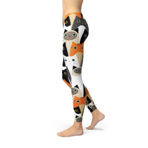 May include: Black, white, orange, and brown leggings with a repeating pattern of cat faces.