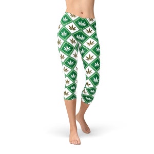 May include: Green and white cropped leggings with a repeating pattern of marijuana leaves in green and gold diamond shapes.