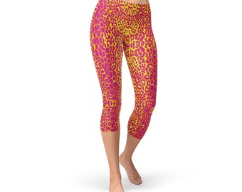 May include: Yellow and pink leopard print capri leggings. The leggings are made of a stretchy, comfortable fabric and are perfect for working out or running errands.