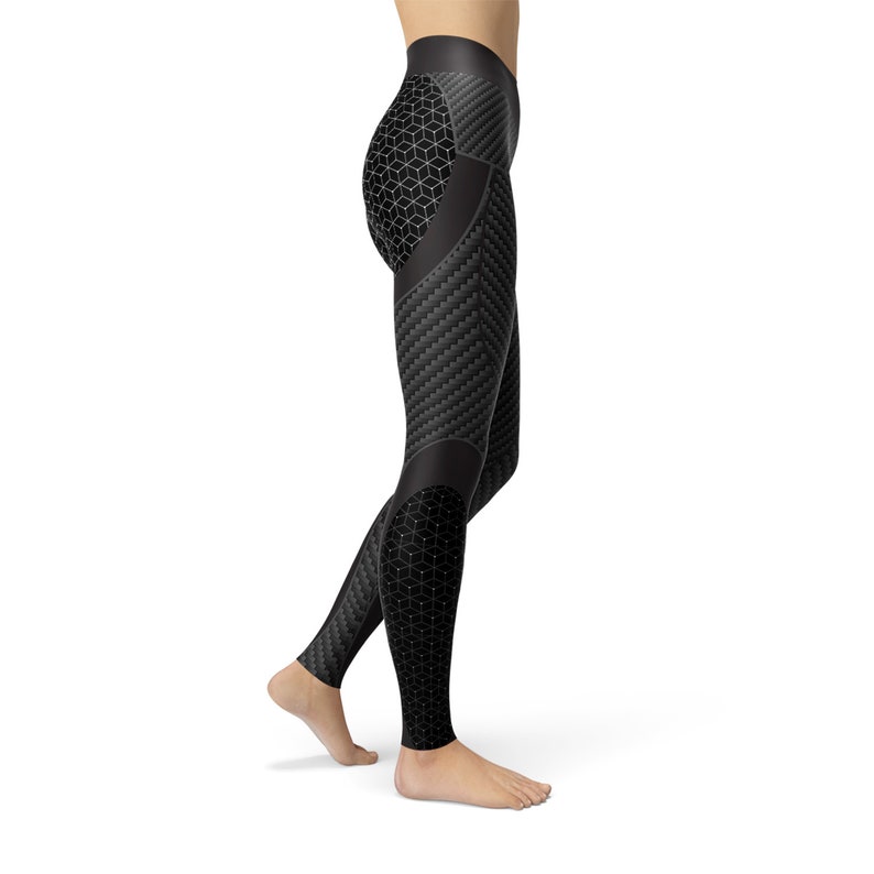 May include: Black leggings with a geometric pattern. The leggings have a carbon fiber design on the legs and a honeycomb pattern on the thighs.