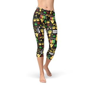 May include: Black capri leggings with a colorful pattern of musical instruments, peace signs, and marijuana leaves.