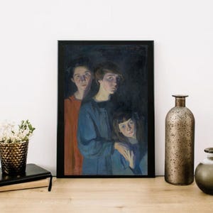 May include: A framed portrait features three figures in a dark setting. The subjects are dressed in shades of blue and red. The artwork is displayed on a wooden surface, with decorative items in the background.