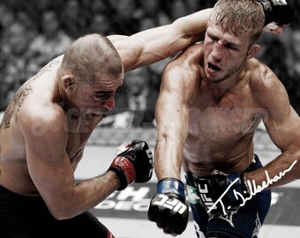 May include: Two mixed martial arts fighters in a black and white photo. One fighter is wearing black shorts and a black and white tattoo on his arm. The other fighter is wearing blue shorts with a white UFC logo and a white signature.