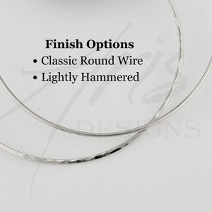 Close up image of finish options, including classic round wire or a lightly hammered finish that produces a subtle glint in the light.