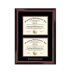 May include: A mahogany wood frame with a black mat and two diploma certificates inside. The certificates are for "Framing Achievement, Inc." and feature a gold seal with the company's name. The bottom of the frame has the text "Personalized Embossing Reer".