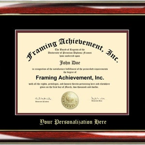 May include: A framed diploma with a maroon and gold border. The text on the diploma reads "Framing Achievement, Inc." and "The Board of Regents of the University of Premium Diploma Frames have conferred upon John Doe in recognition of the satisfactory fulfillment of the prescribed requirements the degree of Framing Achievement, Inc. with all the rights, privileges, and honors thereto pertaining here and elsewhere given on the first day of March, two thousand and twelve."