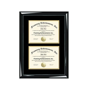 May include: A black frame with a gold mat holds two framed certificates. The certificates are for "Framing Achievement, Inc." and are awarded to "John Doe".