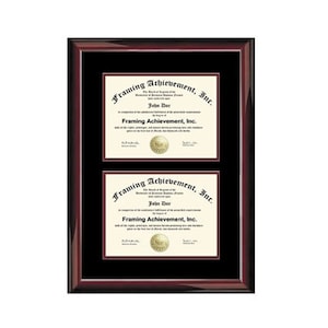May include: A mahogany wood frame with a black mat and two diplomas inside. The diplomas are for "Framing Achievement, Inc." and are both signed by "John Doe".